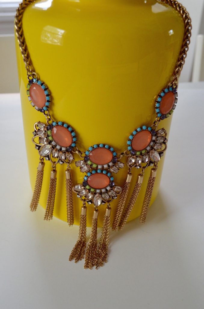 necklaceonyellowvasesticksandstones