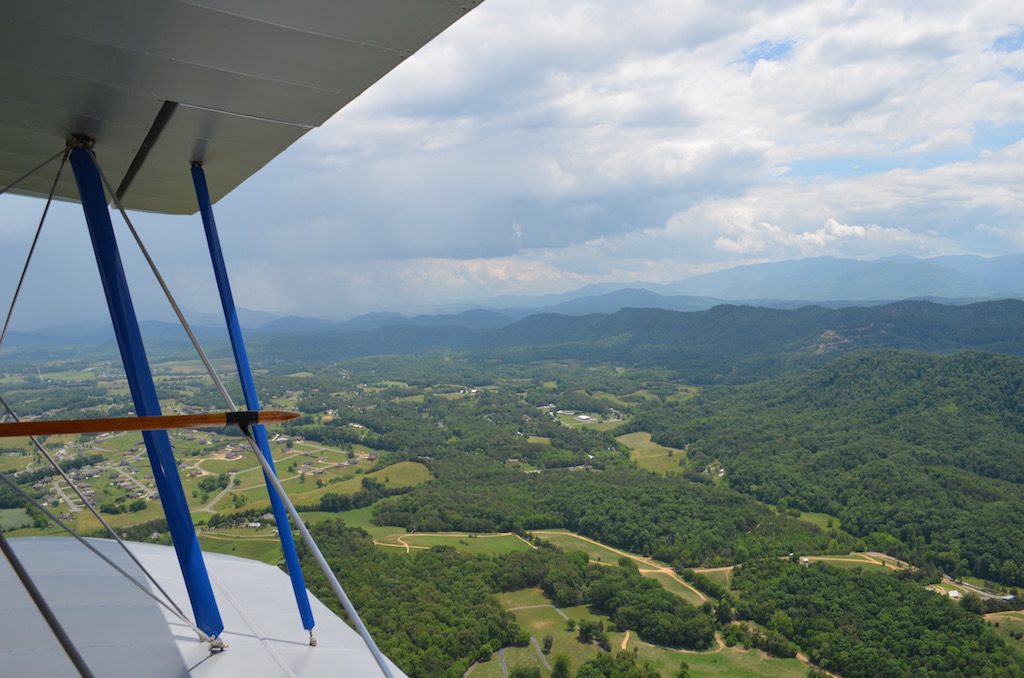 sideviewwithbiplaneandmountains